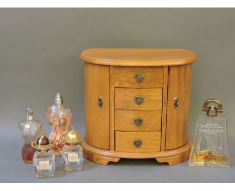 A modern beechwood jewellery chest, in the form of a commode, 23cm high, and five scent bottles