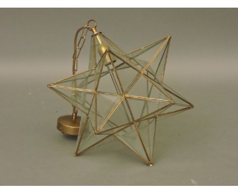 A large star shaped lead glass light fitting