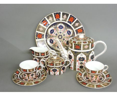 A Royal Crown Derby 'Old Imari' pattern two place teaset, comprising teapot, milk jug, sugar box, two cups and saucers, side 