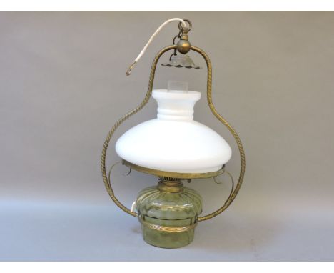 A hanging oil lamp, with a green glass reservoir, 50cm high