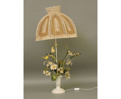 A metal 'vase of flowers' table light, with rope work shade