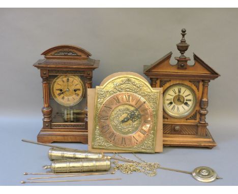 Two wooden mantel clocks, and a hanging wall clock
