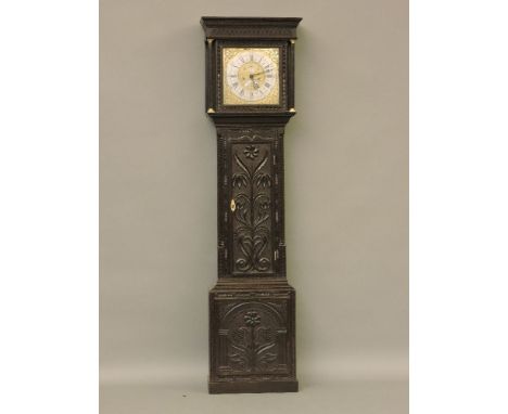 An oak longcase clock, with later carving, the 12in square brass dial converted to 8 day, inscribed 'Richard Midgley' with ro