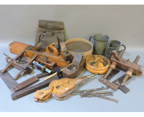 A box of woodworking tools, including a long flat plane, 55cm, two moulding planes, two brass mounted, two levels, etc