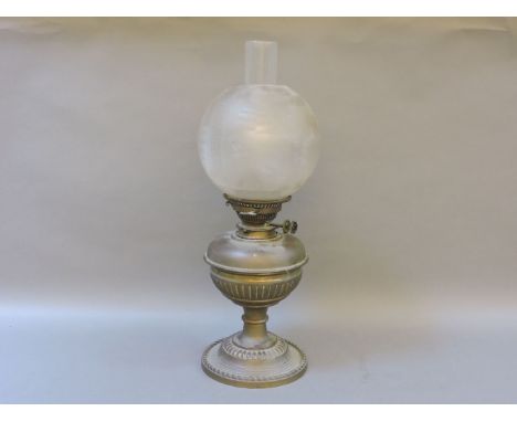 A brass oil lamp, with Messenger's No 2 burner, and an etched fern shade, 54cm to chimney