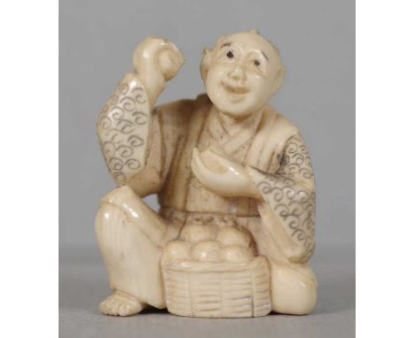 Antique Japanese carved ivory netsuke depicting a man holding fruit, signed to base, 4.8cm high. This item may not be exporte