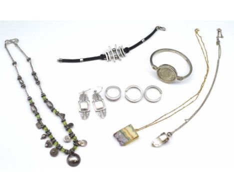 Jewellery group to include silver hoop earrings and a ring, a converted watch bangle with shilling inset etc.