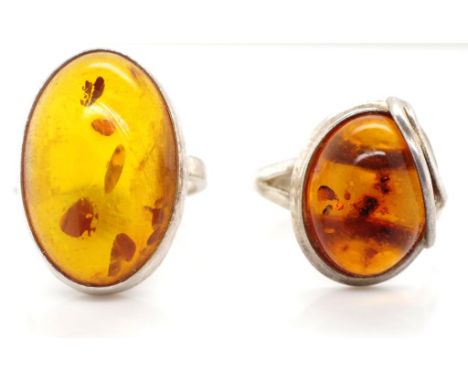 Two sterling silver and amber rings marked 925 approx ring size L and P