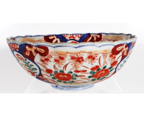 Japanese Imari ceramic bowl iron red and cobalt blue floral decoration to interior and exterior of bowl. (Diameter 25cm, heig