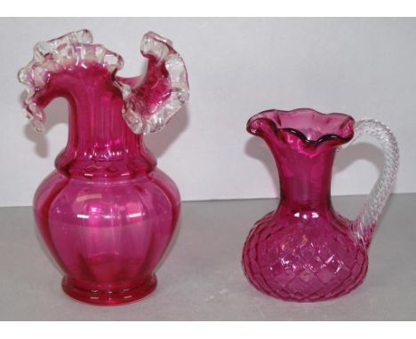 Two various vintage ruby glass pieces including jug, with clear glass handle, (height 15cm approx); together with ruby glass 