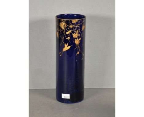 Royal Doulton Titanium vase decorated in gilt with a bird &amp; trailing vines, 20.5cm high approx., tiny loss to rim