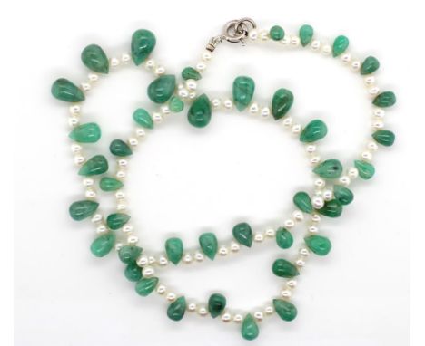 Pearl and jade necklace with a marked 9k gold spring ring. Approx length 38 cm