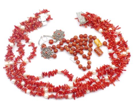 A group of coral jewellery to include a four strand coral and pearl necklace As well as some apple coral necklace and earring