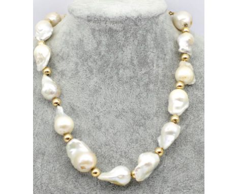 9ct gold and baroque pearl necklace marked 375 to spring ring clasp approx. 48cm length. Some loss to pearls