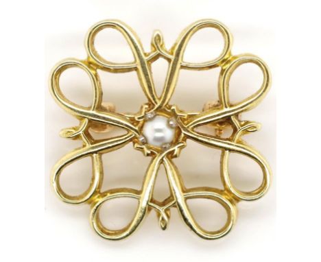 10ct gold and pearl brooch open fret work panel set with a central small white pearl marked 10k approx total weight 1.4 grams