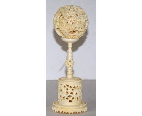 Vintage Chinese carved ivory puzzle ball C1950,decorated with carved dragons to both stand and ball, height 21cm approx.  Thi