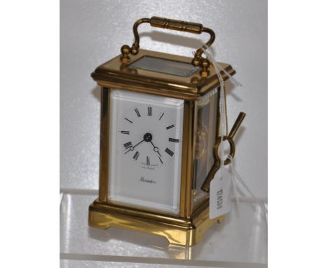 English brass carriage clock with Swiss movement &amp; key, 14cm high approx.