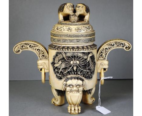 Antique Chinese carved ivory lidded pot decorated with mask &amp; ring twin handles, tri-footed foo dog legs &amp; lid and ca
