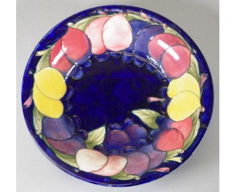 Walter Moorcroft 'Pomegranate' ceramic bowl 'Pomegranate' pattern, marked to base. (Diameter 27.5cm approx).