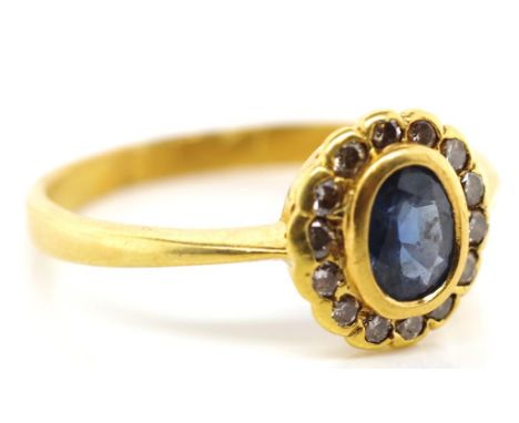 Sapphire diamond and 18ct gold daisy ring. Early 20th hand made ring marked 18ct  approx 3.4 grams, ring size U