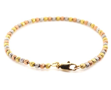 Tri colour 9ct gold beaded bangle white, yellow and red gold beds threaded on a single piece of 0.8mm gauge wire. marked 375 