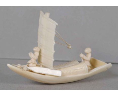 Antique Chinese marine ivory sail boat with 2 male figures on board, small loss to rope held by aft man, 10cm wide, 6.4cm hig