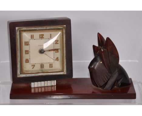 Vintage Bakelite desk clock with dog figure clock marked 'Bayard,' on composite stand with dog figure. (Clock needs service).