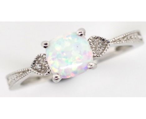 14ct white gold, diamond and opal ring weight: approx 2 grams, ring size O. cushion cut cabochon opal 6mm x 6mm