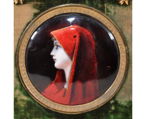 Framed enamel plaque of a lady in red cape, signed 'R', 15cm x 13cm frame approx.