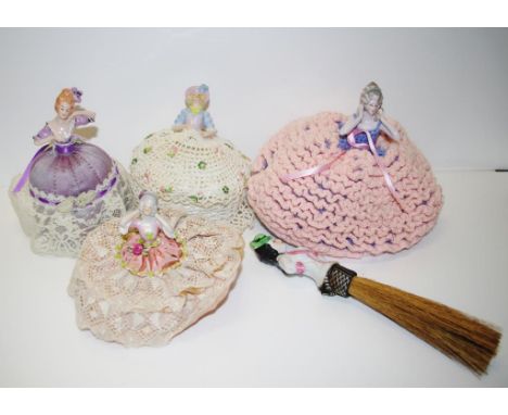 Five vintage ceramic half dolls including 4 with embroidered dresses, and 1 with brush attachment.