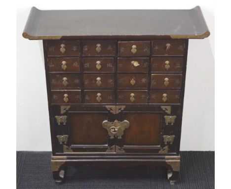 Small wooden Chinese chest of drawers with 16 small drawers over a two door cabinet. 61cm wide by 21cm deep and 66cm tall.