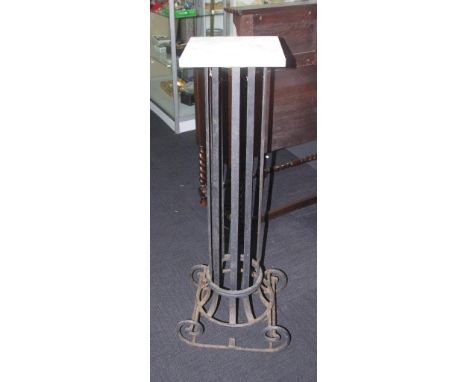 Wrought iron planter stand with a stone top, 121cm high approx.