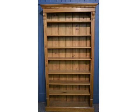 A seven shelf open pine bookcase 78in. (198.2cm.) high. 