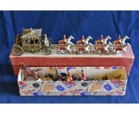 A Lesney Coronation Coach scale diecast model horse drawn coach comprising of a golden carriage with Queen seated being pulle