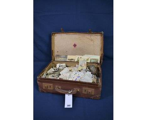 A large collection of various tea and cigarette cards contained in vintage brown leather suit case. ( very large quantity) 