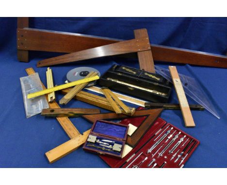 A collection of vintage and antique Draftsmans tools comprising of a c1950's cased Riefler A58 draftsman set; parallel rollin