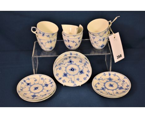 A set of six Royal Copenhagen cups and saucers painted in underglaze blue in 'Onion' pattern, green printed and blue painted 