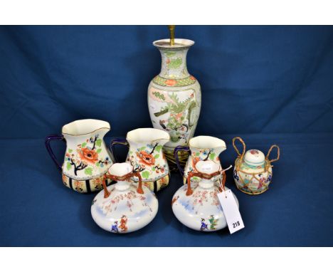 A pair of Japanese porcelain twin handled vases together with a Chinese lamp base, three graduated Losol ware jugs plus anoth