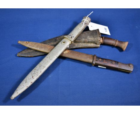 Two German K98 bayonets, the first stamped Elite-Diamant 2669 f to blade but ffc 1940 to scabbard, the second stamped F. Herd