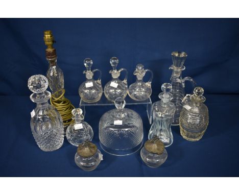 A quantity of various glassware to include a Waterford decanter, Art Deco decanter and a pinched hourglass whiskey decanter (