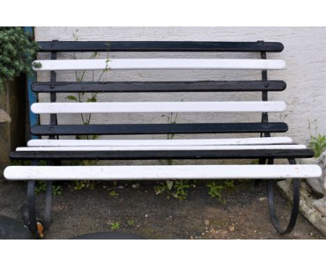 A painted wrought iron and wood Victorian bench, 54ins  