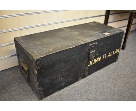 A vintage black painted pine storage box with carrying handles, 30in. (76.2cm.). 