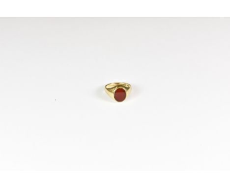 A 9ct gold and carnelian signet ring, size K. 