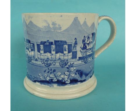 A cylindrical pottery mug printed in blue with a locomotive named London pulling passenger carriages one named Victoria, circ