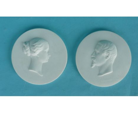 Napoleon III, Eugenie and Prince Imperial: a pair of white bisque porcelain portrait medallions each with impressed detail, c