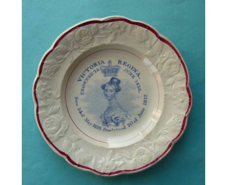 1838 Coronation: a good potter nursery plate with floral and foliate moulded border lined in pink, printed in blue with a nam