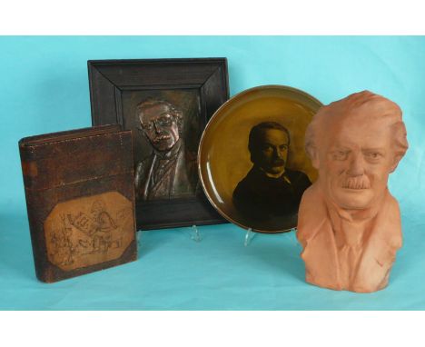 Lloyd George: a Ridgway portrait plate, a terracotta bust, 262mm, a framed embossed copper portrait plaque and a wooden faux 
