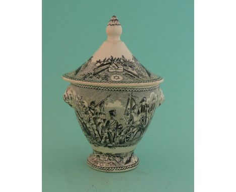 Napoleon: a pottery cup and cover set with twin animal maskhead handles, printed in black with battle scenes, the cover inscr