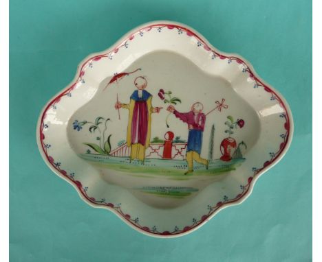A good Newhall quatrelobe teapot stand painted in brightly coloured enamels with figures on a terrace on the Oriental taste, 