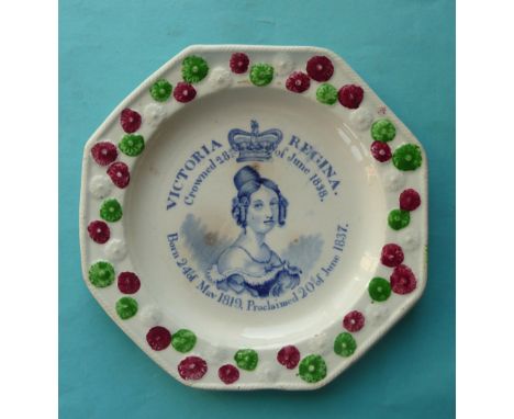 1838 Coronation: an octagonal pottery nursery plate with florette moulded border coloured green and red, printed in blue with